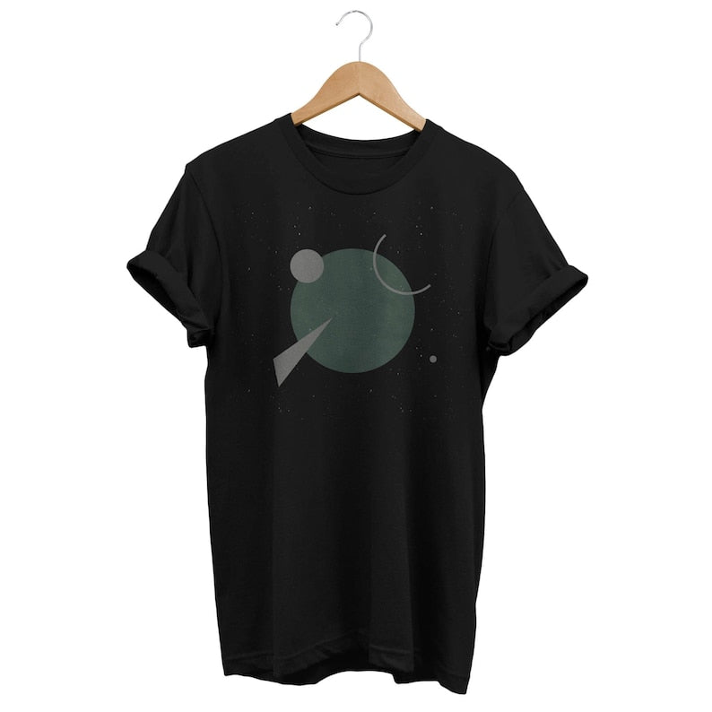 Black t-shirt on a hanger with a simple abstract geometric design in muted green and black.