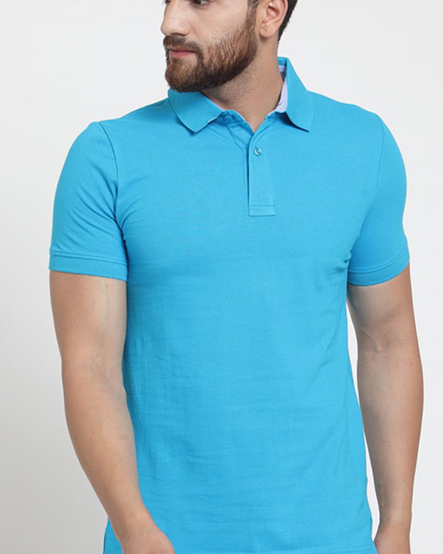 Front view of a man wearing a sky blue polo t-shirt