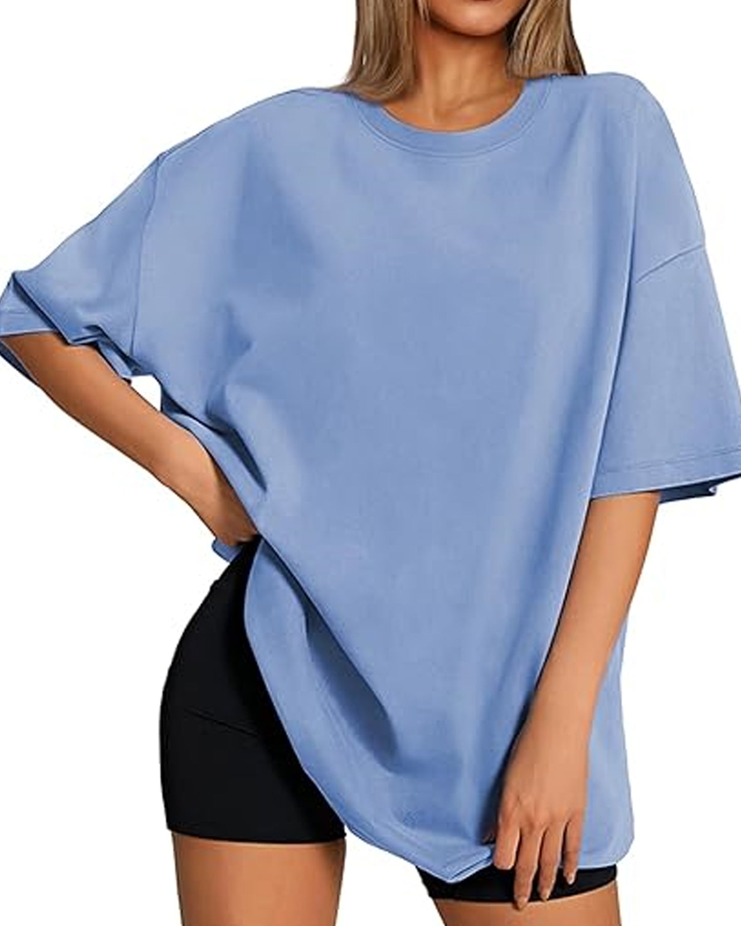 Front view of a person with long blonde hair wearing a light blue oversized t-shirt.