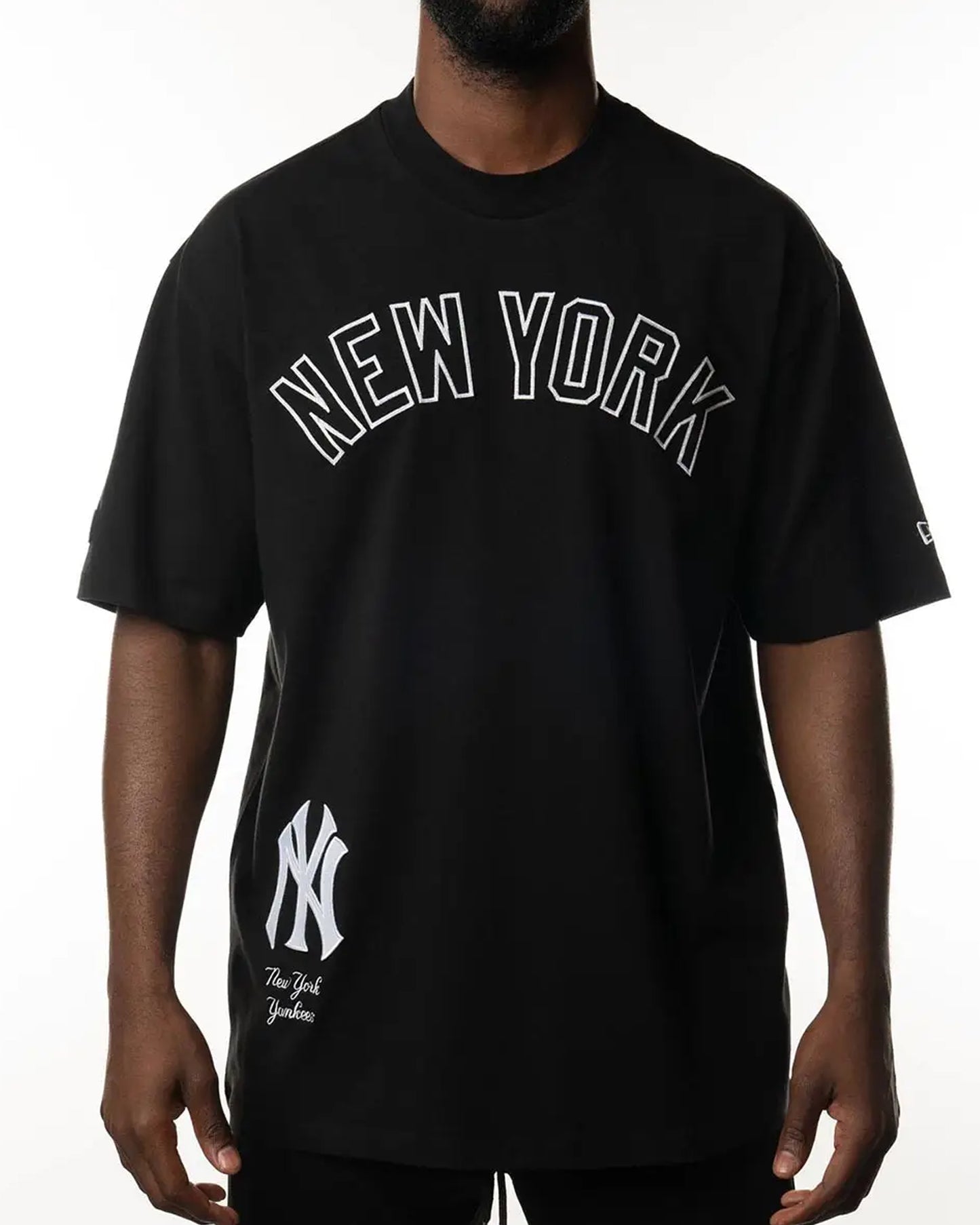A man wearing a black New York
Yankees t-shirt _Bold_Style_Team_Pride_front_view