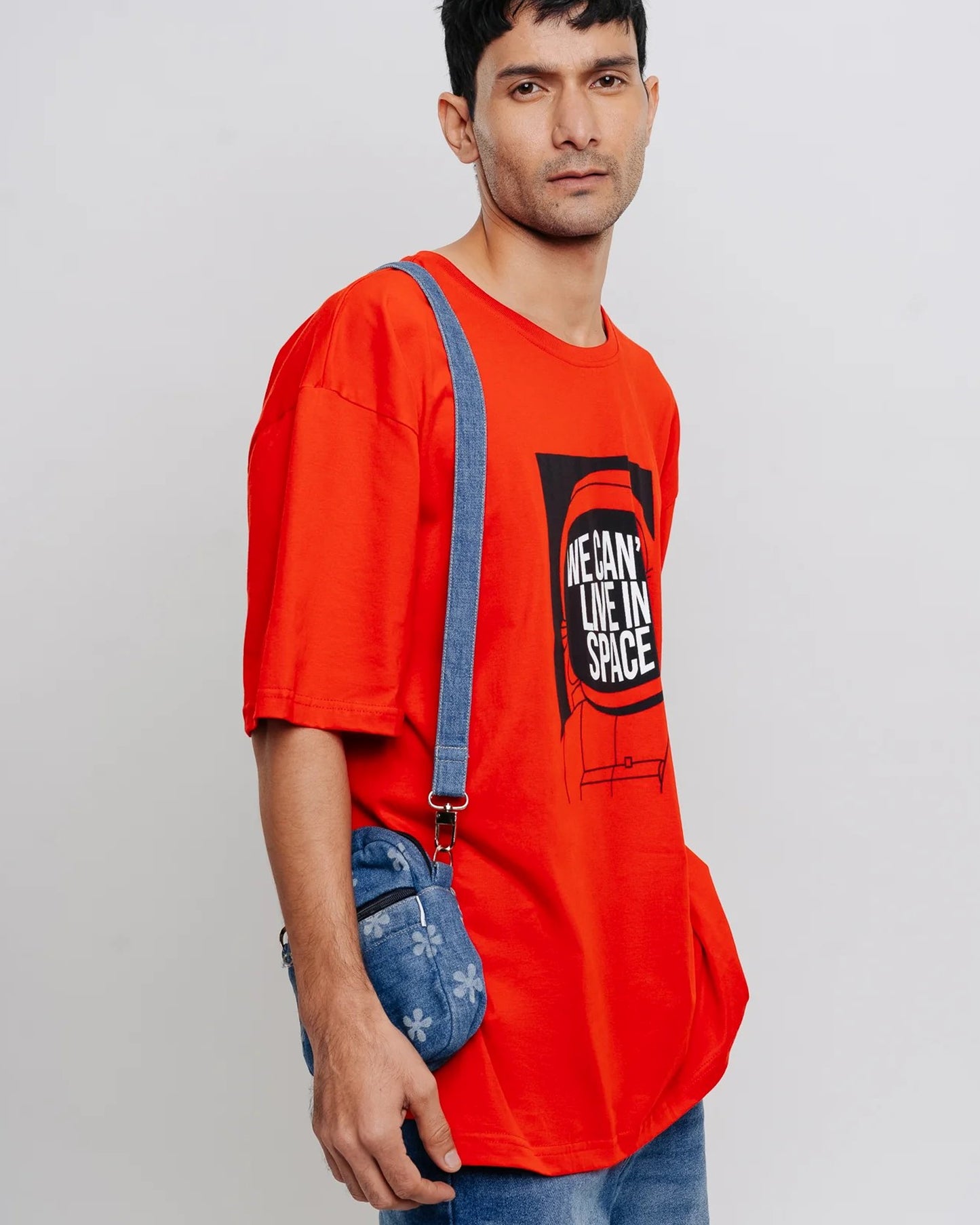 Right Sided View of We Can Live In Space Printed Red Oversize T-Shirt