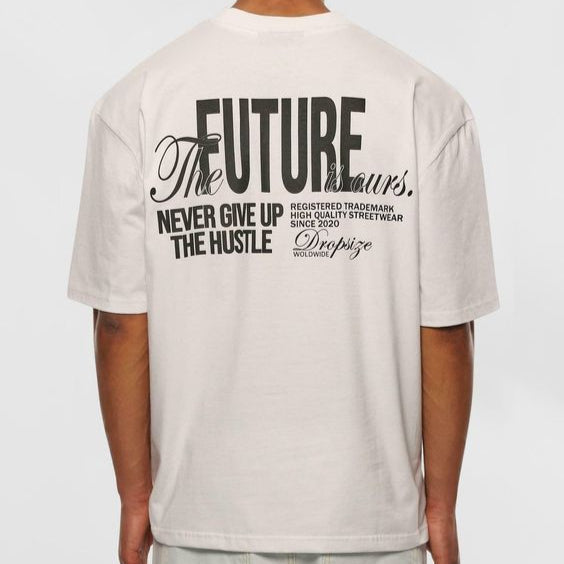 Light-colored oversize t-shirt with "The Future is Ours" text, "Never Give Up The Hustle" text, and "Dropize" branding on the back.