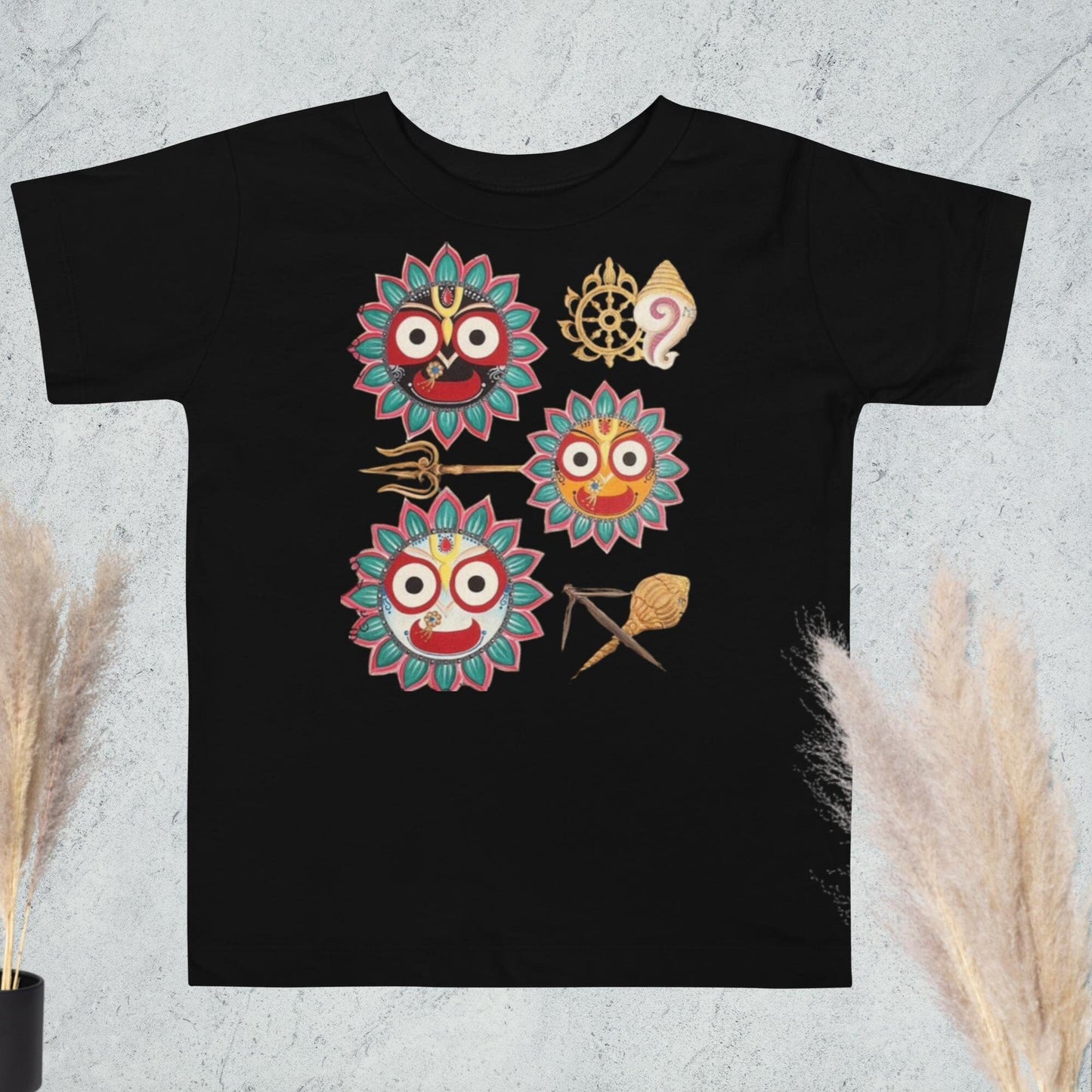 A black t-shirt featuring Jagannath's eyes and divine symbols, representing love, power, and grace.