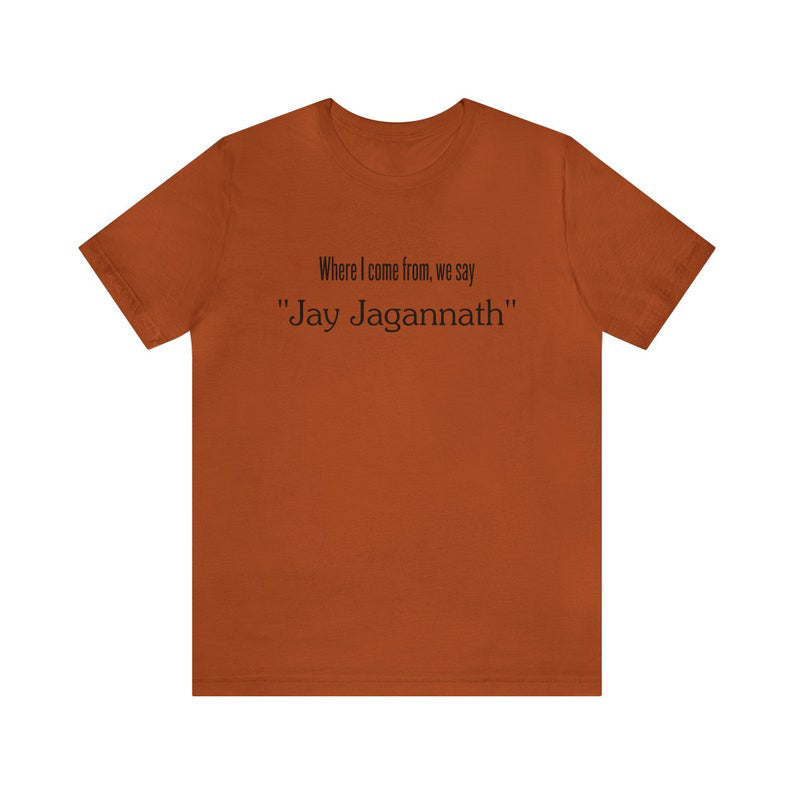 Brown t-shirt with the quote "Where I come from, we say Jay Jagannath," celebrating devotion to Lord Jagannath. Perfect for devotees and spiritual seekers.