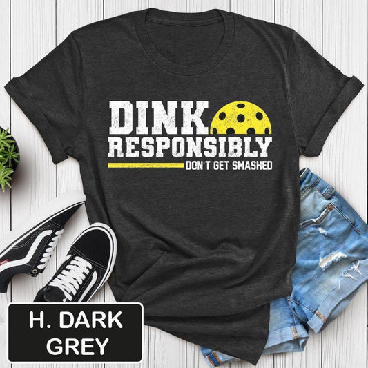Dark grey t-shirt with "Dink Responsibly Don't Get Smashed" quote and pickleball graphic.