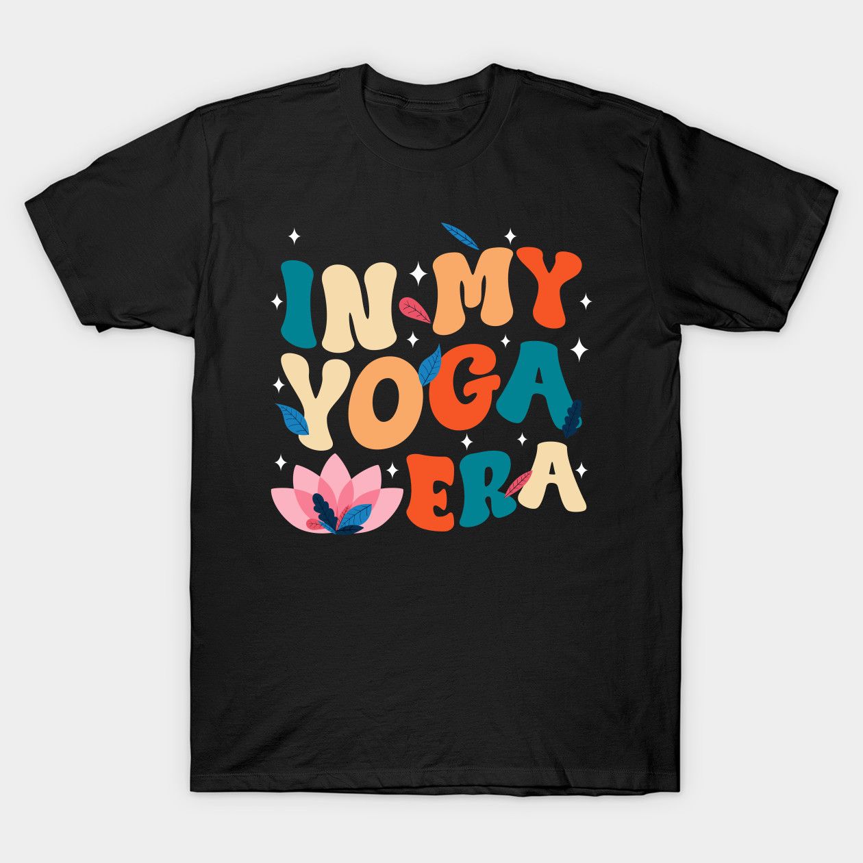 Black t-shirt with "In My Yoga Era" in retro-style colorful letters and a lotus flower.