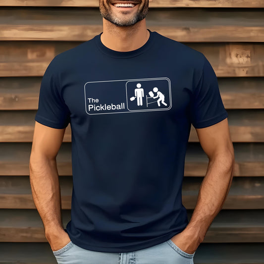 Navy t-shirt with "The Pickleball" text and stick figure player graphic.