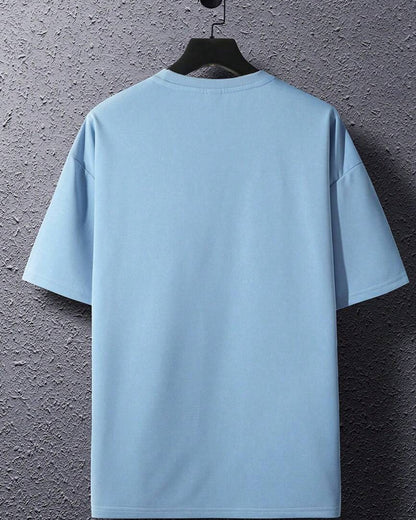 Kitten Pocket T-Shirt Playful Graphic on Light Blue Fabric