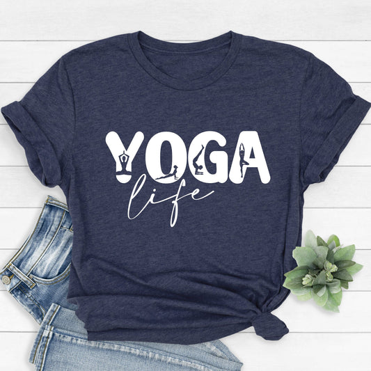 Dark blue t-shirt with "Yoga Life" text and small yoga pose symbols, styled with jeans and plant.