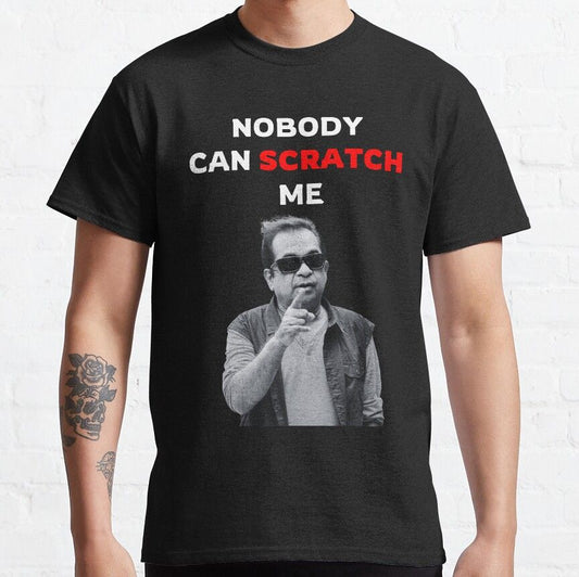 Black t-shirt with the English phrase 'Nobody Can Scratch Me' and an image of Telugu comedian Brahmanandam pointing.  Humorous design celebrating his iconic status on a comfortable t-shirt.