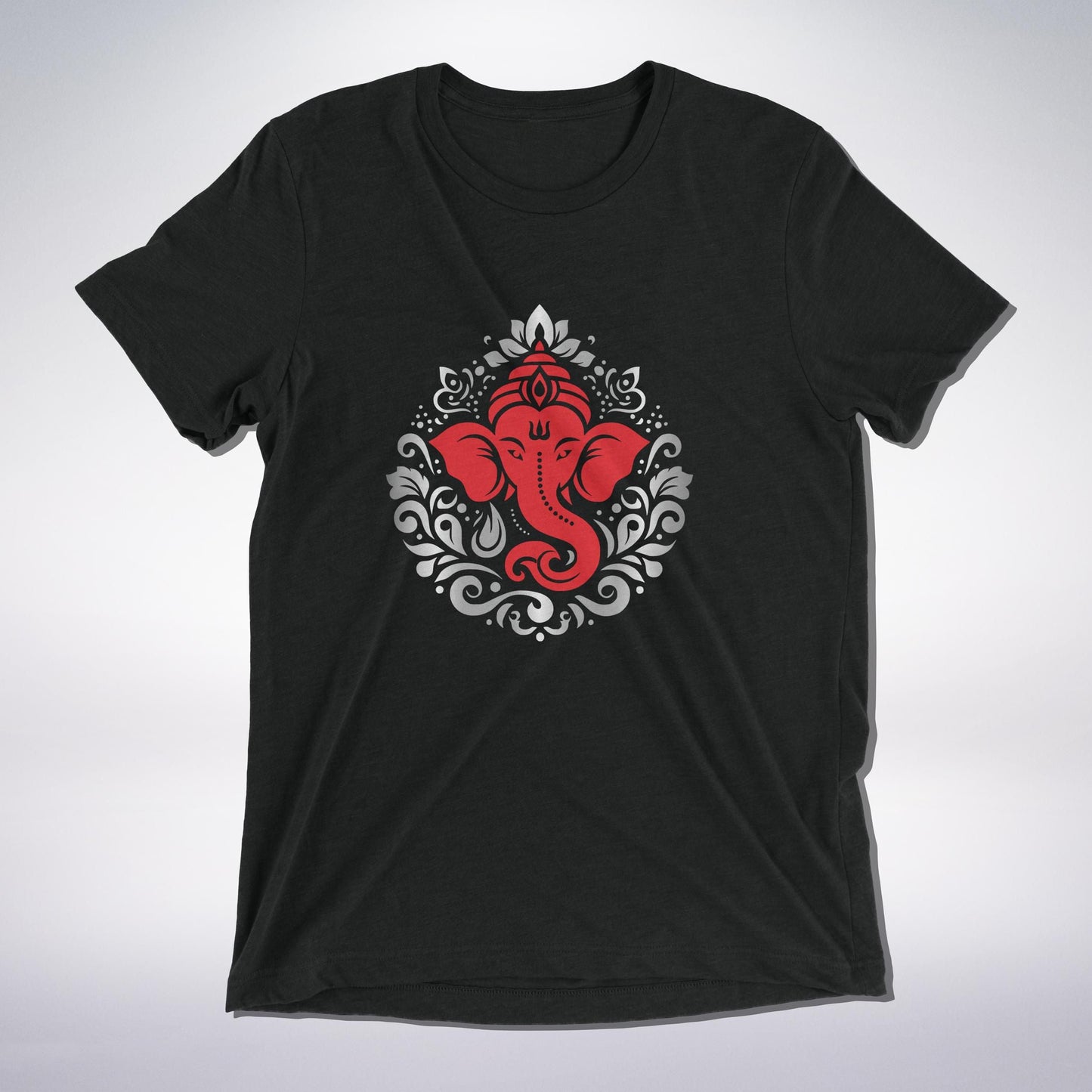 A sacred black T-shirt adorned with a powerful red depiction of Lord Ganesha, the remover of obstacles. Surrounded by intricate gray and white ornamental patterns, this design radiates devotion, protection, and divine blessings. A must-have for every Ganesha bhakt! 🙏✨