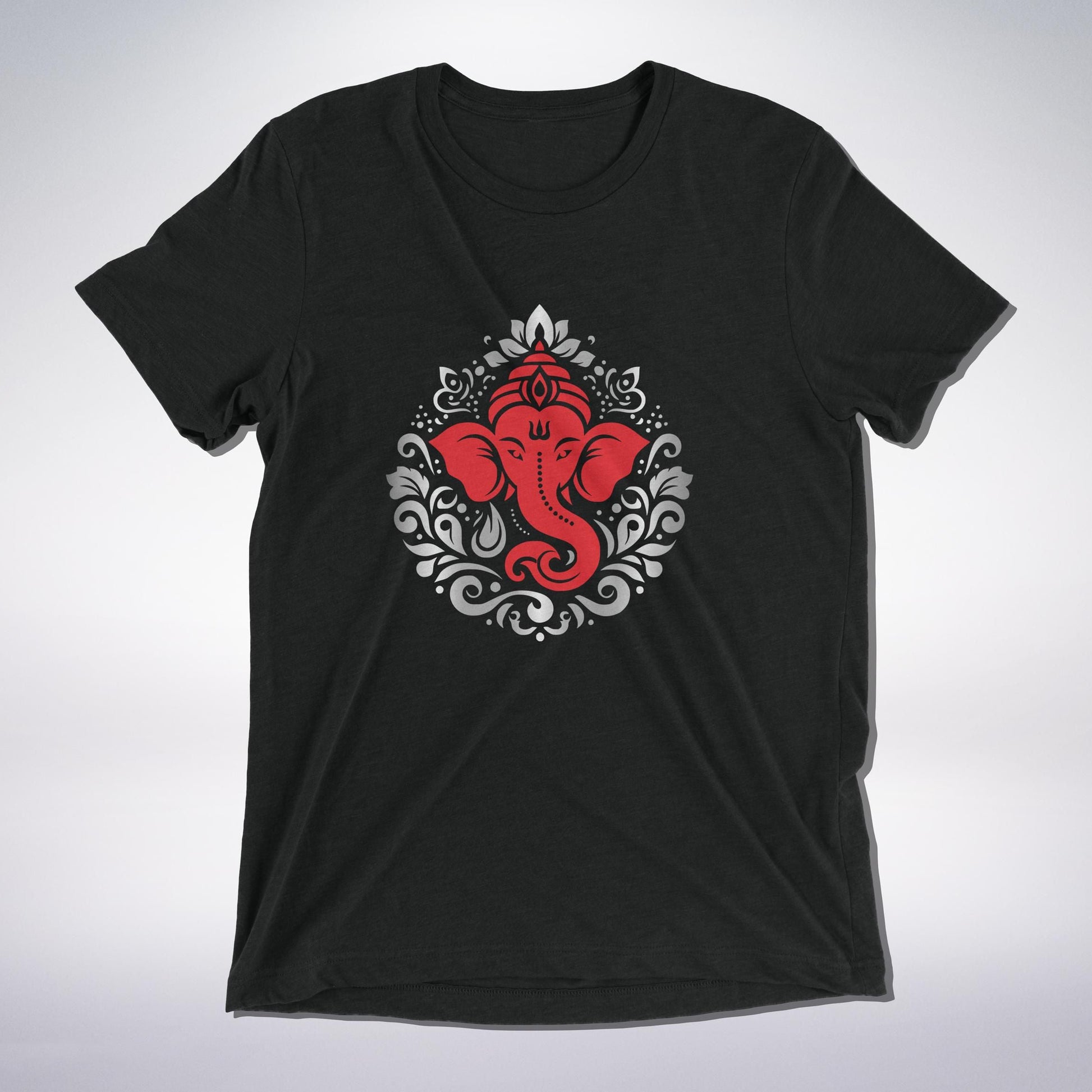 A sacred black T-shirt adorned with a powerful red depiction of Lord Ganesha, the remover of obstacles. Surrounded by intricate gray and white ornamental patterns, this design radiates devotion, protection, and divine blessings. A must-have for every Ganesha bhakt! 🙏✨