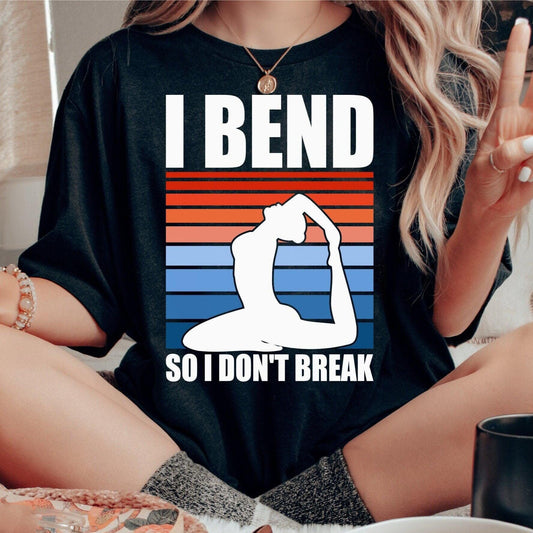 Black t-shirt with "I Bend So I Don't Break" quote, yoga pose silhouette, and striped background.