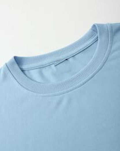 Kitten Pocket T-Shirt Playful Graphic on Light Blue Fabric
