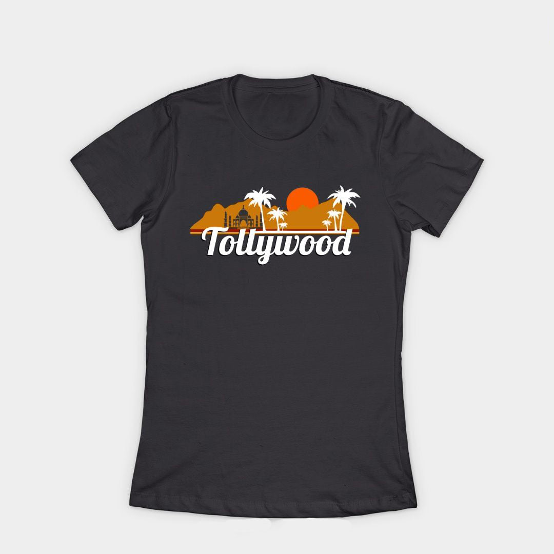 Black t-shirt with the word 'Tollywood' in white letters below a sunset graphic with palm trees and mountains.  Telugu film industry pride design on a comfortable t-shirt.