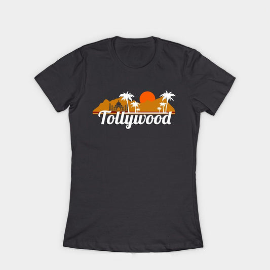Black t-shirt with the word 'Tollywood' in white letters below a sunset graphic with palm trees and mountains.  Telugu film industry pride design on a comfortable t-shirt.