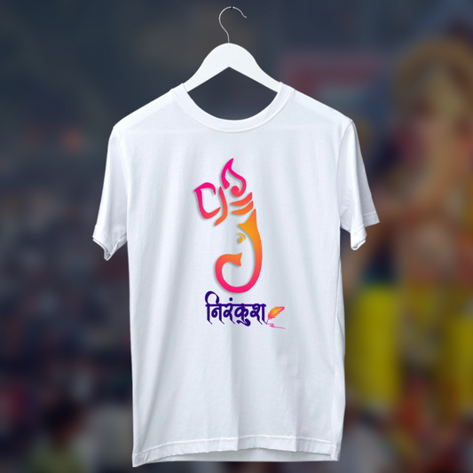 A white T-shirt featuring a vibrant and artistic representation of Lord Ganesha using stylized typography in shades of pink, orange, and purple. Below the design, the text "निनंदक" is printed in a decorative font, adding a unique touch to the spiritual-themed apparel.