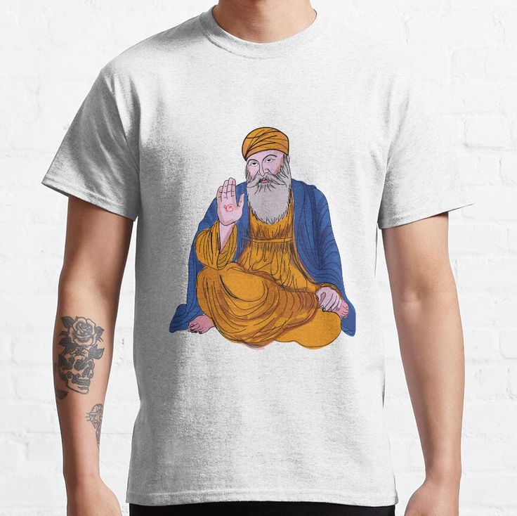 A light grey t-shirt featuring an illustration of Guru Nanak Dev Ji, the founder of Sikhism, offering blessings.