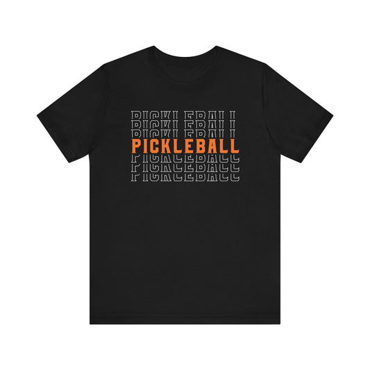 Black t-shirt with repeated "Pickleball" text, one line in orange.