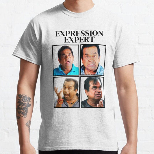 White t-shirt with four images of Telugu comedian Brahmanandam in various expressive poses and the text 'EXPRESSION EXPERT'. Humorous design celebrating his comedic talent on a comfortable t-shirt.