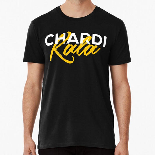 A black t-shirt featuring "Chardi Kala" in white and yellow, celebrating the Sikh spirit of eternal optimism.