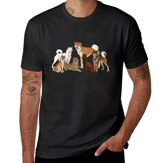  A man, who appears to be East Asian, is wearing a black t-shirt featuring a vibrant illustration of multiple Akita dogs.