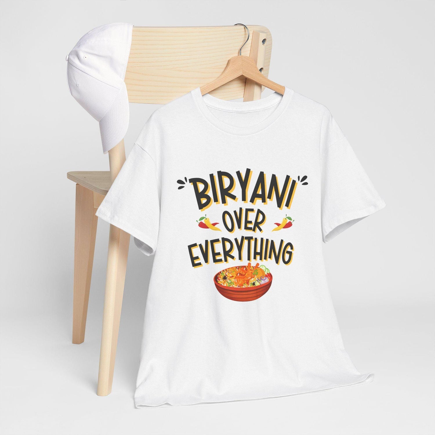 White t-shirt with "Biryani Over Everything" text and a bowl of biryani graphic.  A fun, flavorful design for biryani lovers.