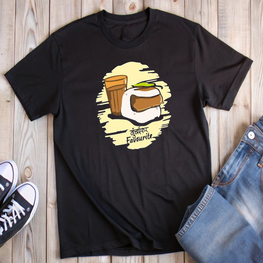 Black t-shirt with a graphic of vada pav, tea in a glass, and "मुंबईकर Favourite" text, styled with jeans and sneakers.
