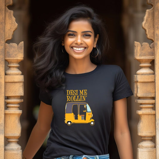 A smiling woman models a black t-shirt with a yellow auto rickshaw graphic and the text "Desi Me Rollin'".