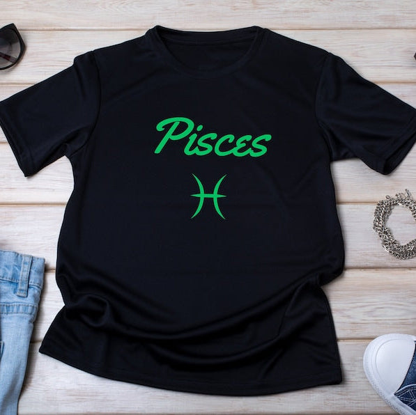 Black t-shirt with the word "Pisces" in green script above the Pisces astrological symbol.