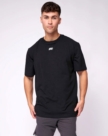 A man wearing a black t-shirt and _Athletic_Look_for_best_Occation front view