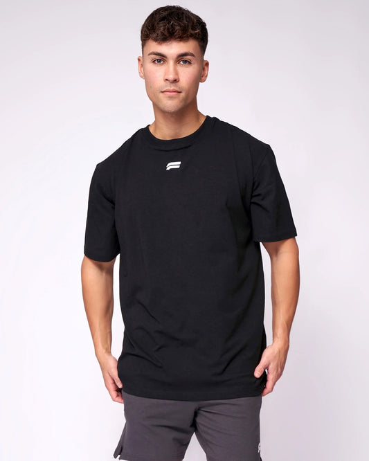 A man wearing a black t-shirt and _Athletic_Look_for_best_Occation front view