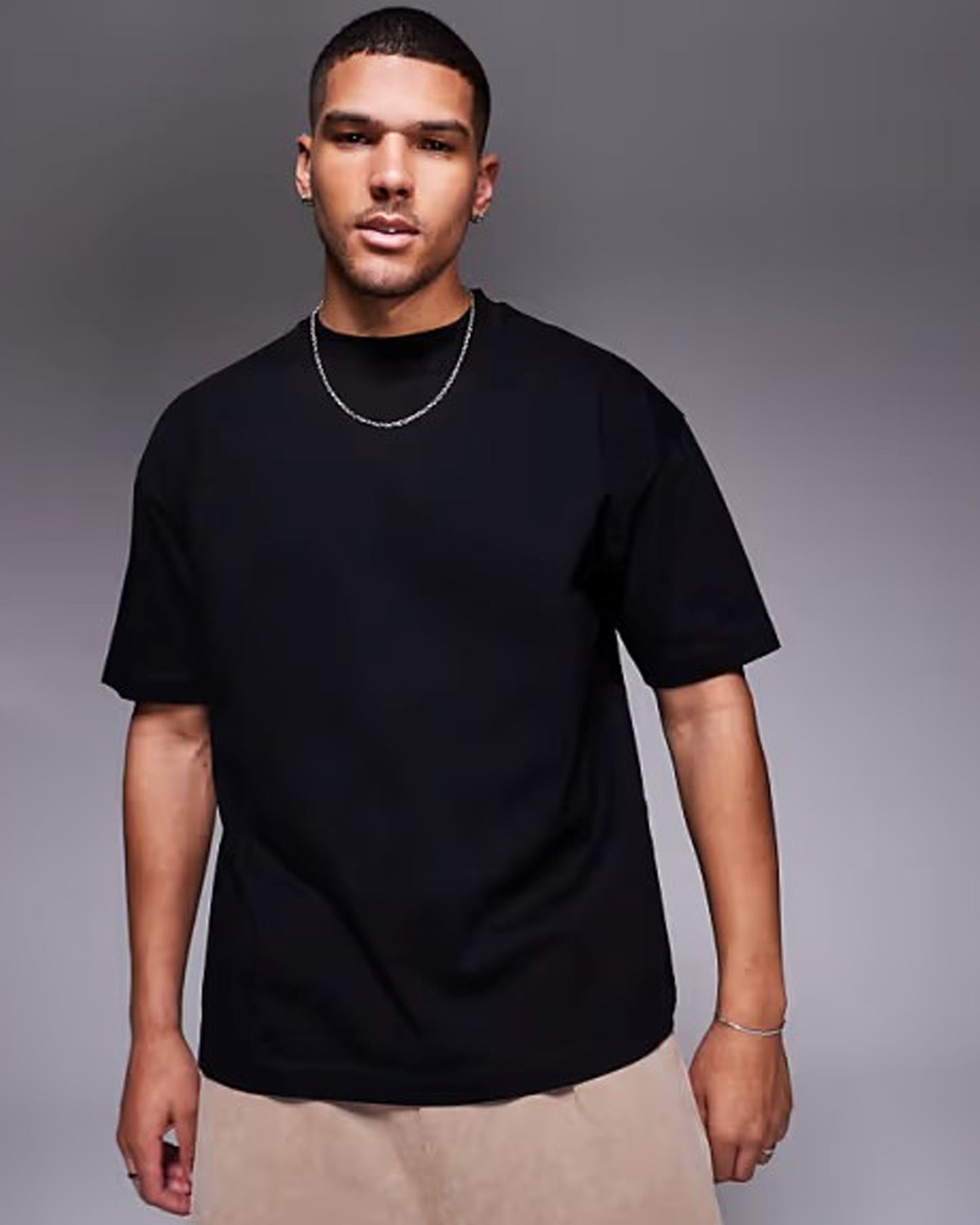 A man in a black t-shirt and light-Elegance_for_the_Modern_Man front side