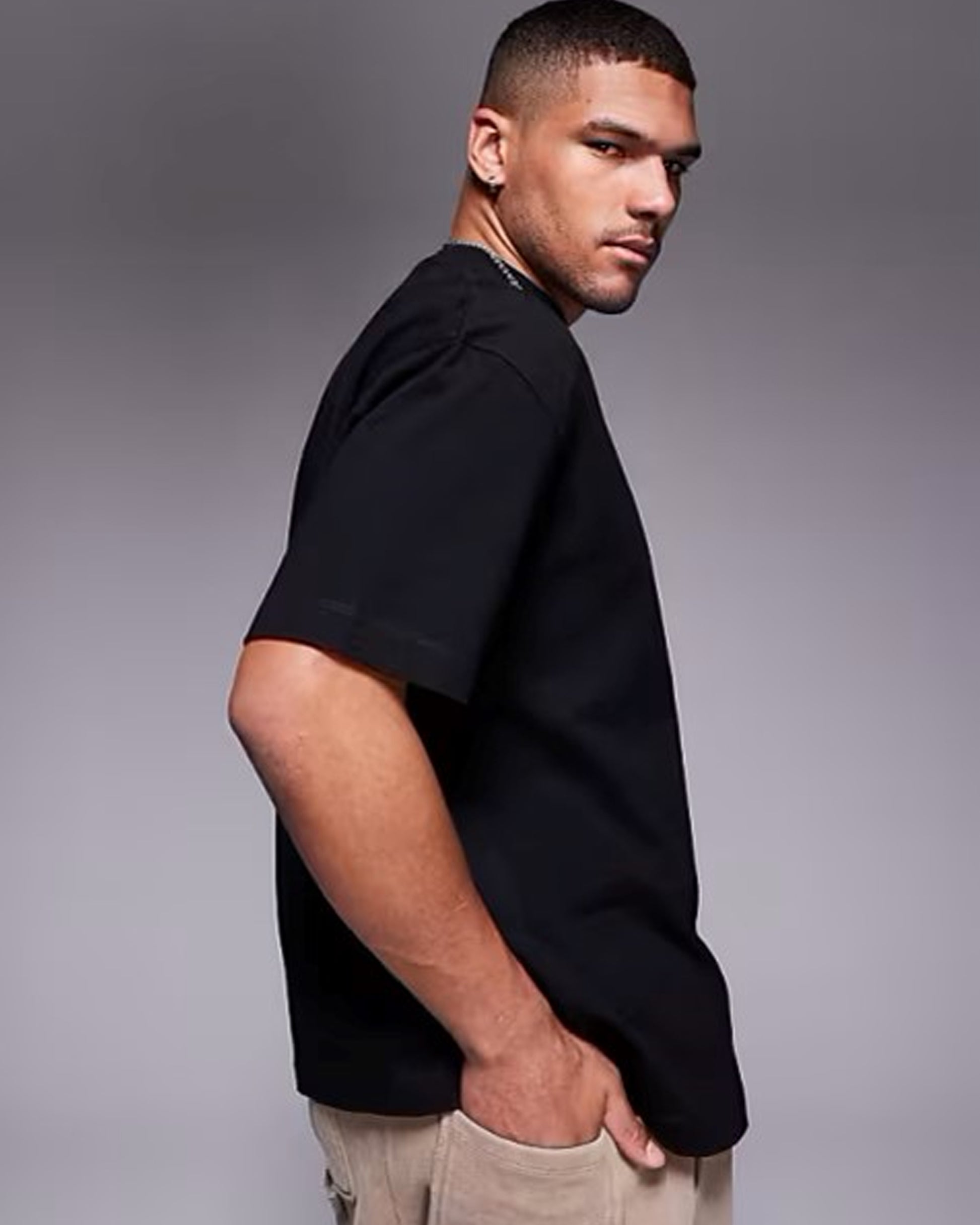 Black_T-Shirt_Style_Simple_Elegance_for_the_Modern_Man front of hand side view