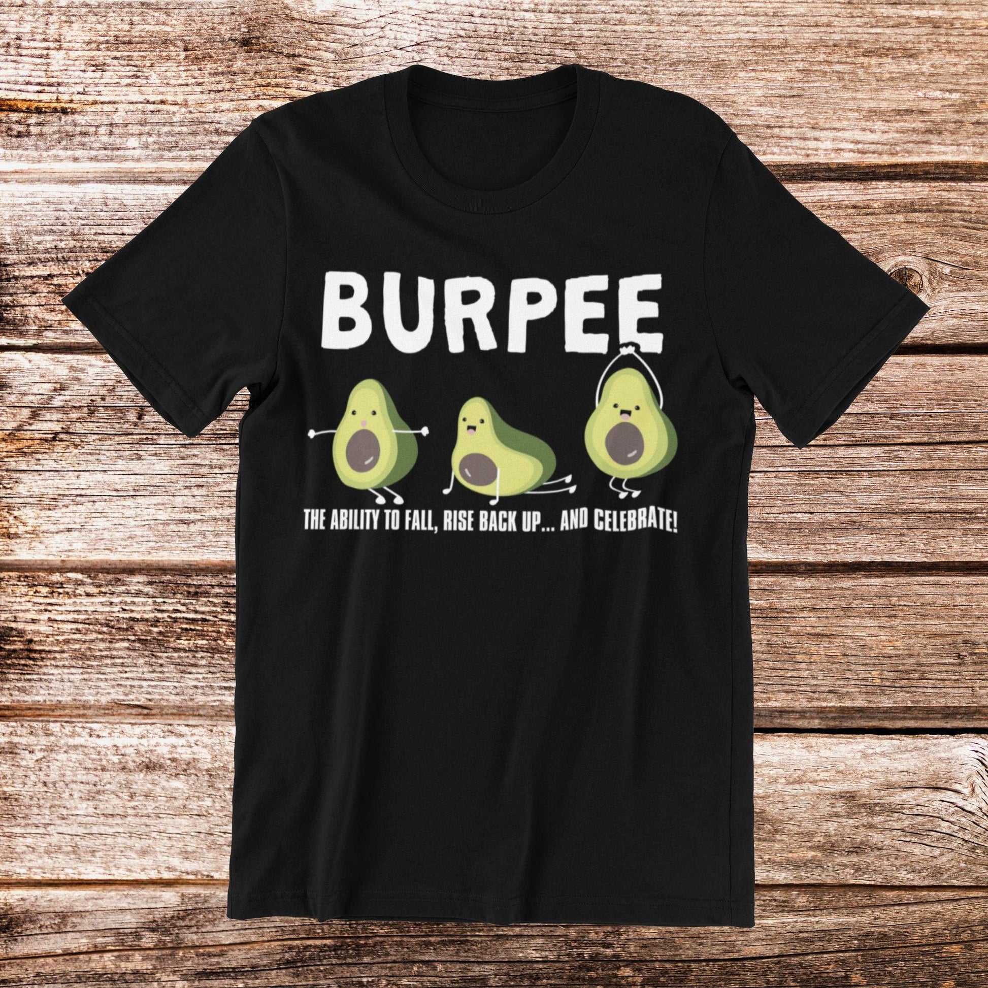 Black t-shirt with "BURPEE" text, avocado cartoon, and "THE ABILITY TO FALL, RISE BACK UP...AND CELEBRATE" quote.