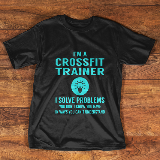 Black t-shirt with "I'M A CROSSFIT TRAINER" text and lightbulb icon.