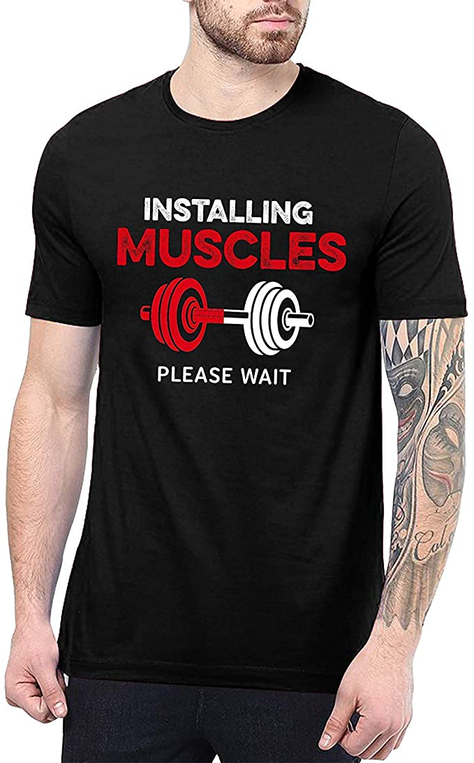 Black t-shirt with "Installing Muscles Please Wait" text and dumbbell graphic on man.