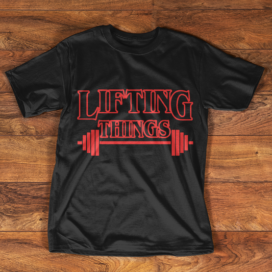 Black t-shirt with "LIFTING THINGS" text and barbell graphic in red.