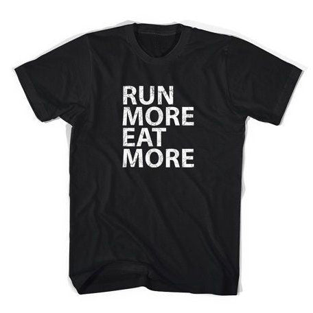 Black t-shirt with bold white text that reads 'RUN MORE EAT MORE,' perfect for running and food lovers.