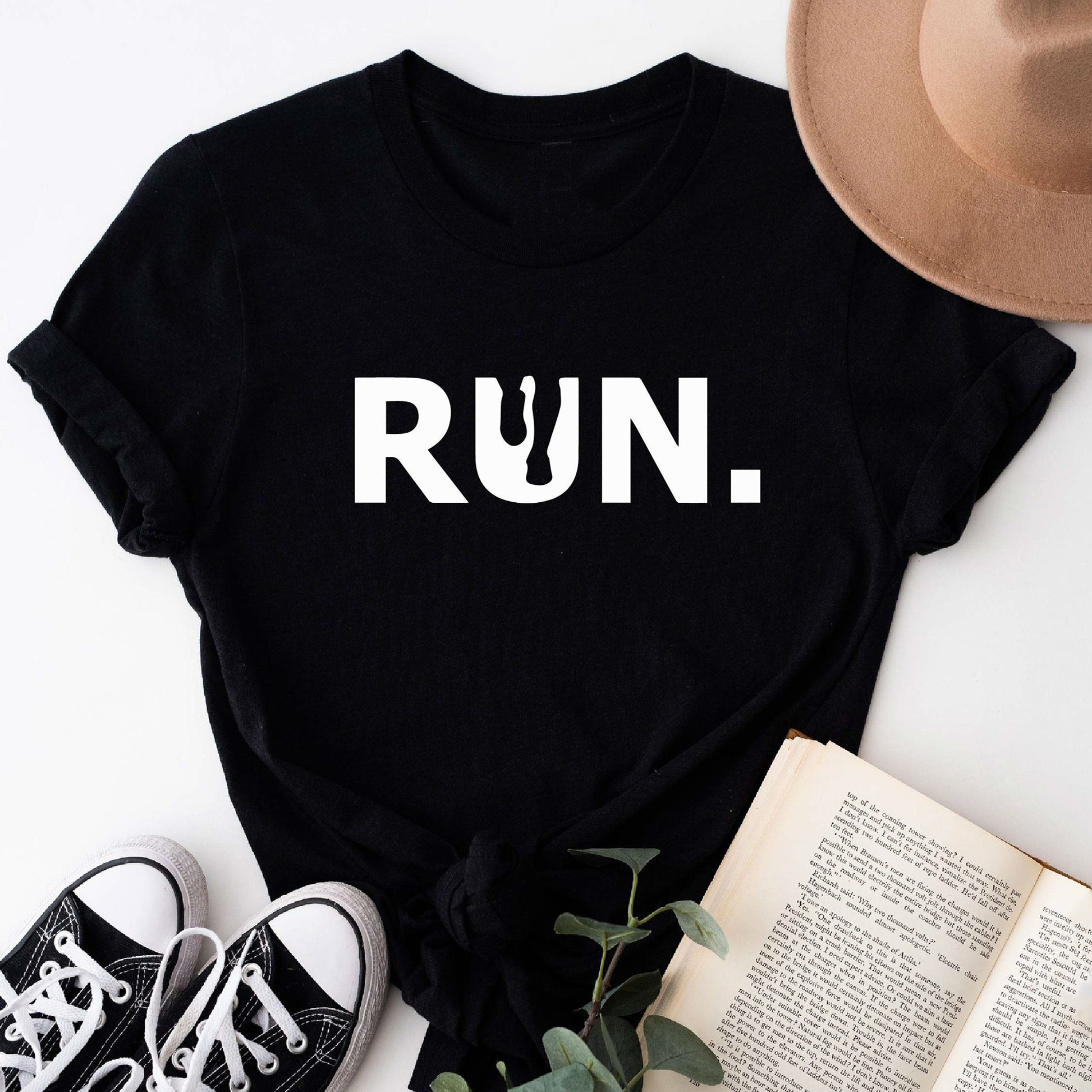 Black t-shirt with large white "RUN." text.