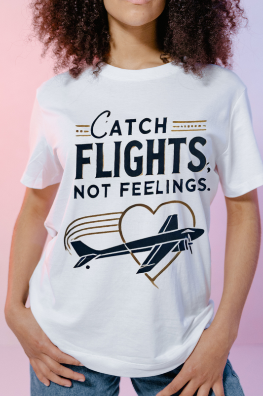 White t-shirt with "Catch Flights, Not Feelings." text and an airplane inside a heart.