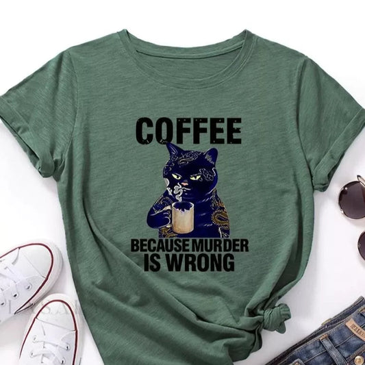 Green t-shirt with "Coffee Because Murder is Wrong" text and a cat drinking coffee graphic. A humorous design for coffee and cat lovers.