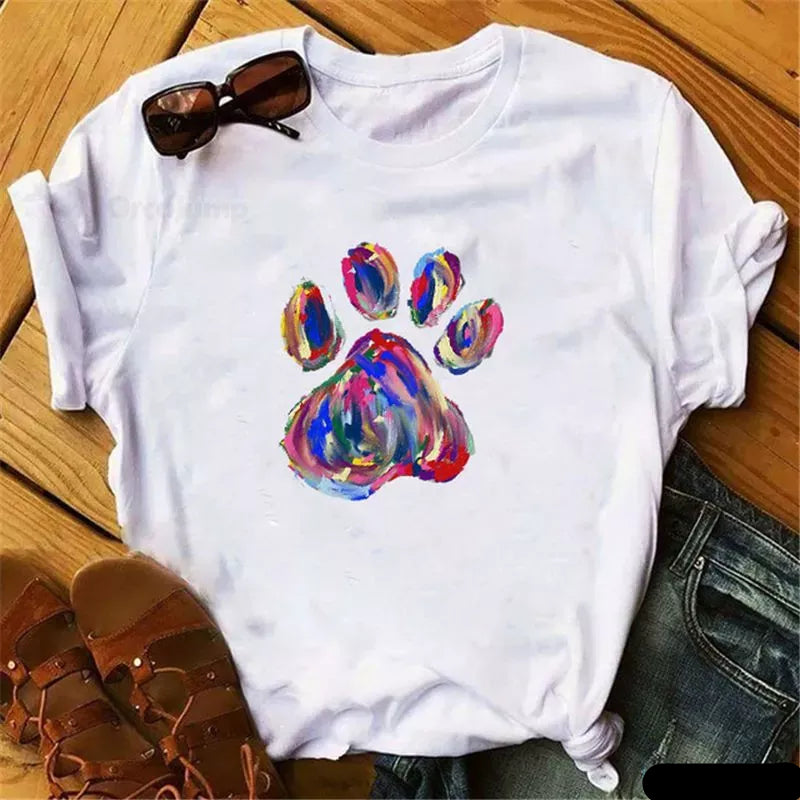 White t-shirt with a colorful, painted-style paw print design on the front.