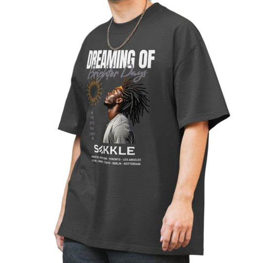 Dark gray oversized t-shirt with "Dreaming of Brighter Days" text and a graphic of a person with dreadlocks on the chest.