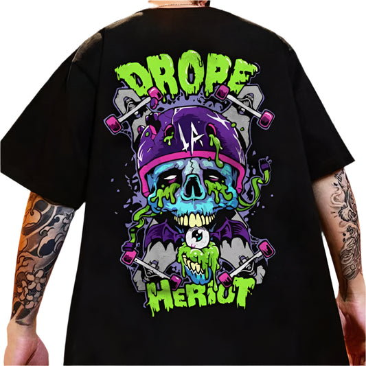Dark-colored oversize t-shirt with "Drope Heriot" text, a skull graphic wearing a skateboard helmet, and skateboard illustrations on the back.