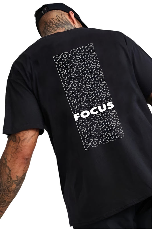  Dark-colored oversize t-shirt with the word "Focus" repeated diagonally in white text on the back