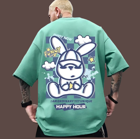 Green oversize t-shirt with a cartoon rabbit graphic, "Funny" and "Happy Hour" text, and "Enjoy Now" and "I AM ORDINARY YET UNIQUE" text on the back.