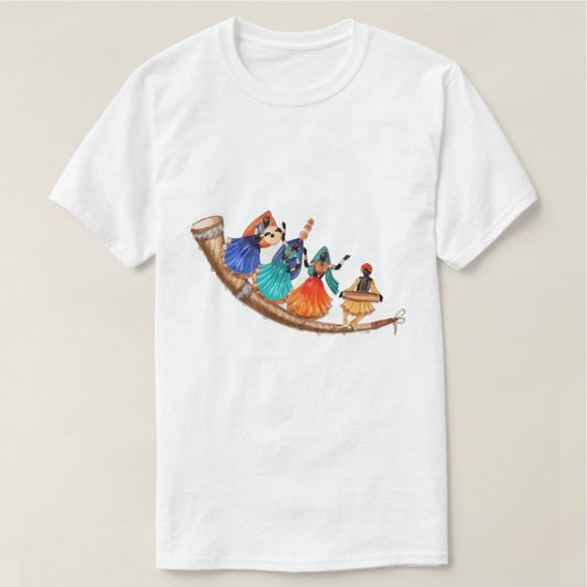 White t-shirt with an illustration of four figures in colorful attire performing a Garba dance, standing on a large, curved horn or musical instrument. Cotton blend t-shirts, available in various sizes.