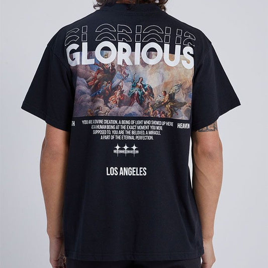 Dark-colored oversize t-shirt with "Glorious" text, an angel painting graphic, "Heaven" and "Los Angeles" text on the back.