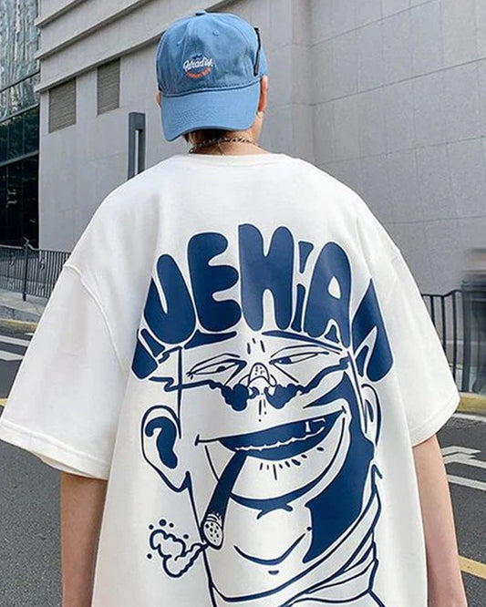 Back view of a person wearing a white t-shirt with a blue graphic face design.